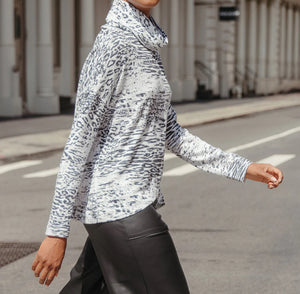 Animal print turtleneck sweater with silver weave
